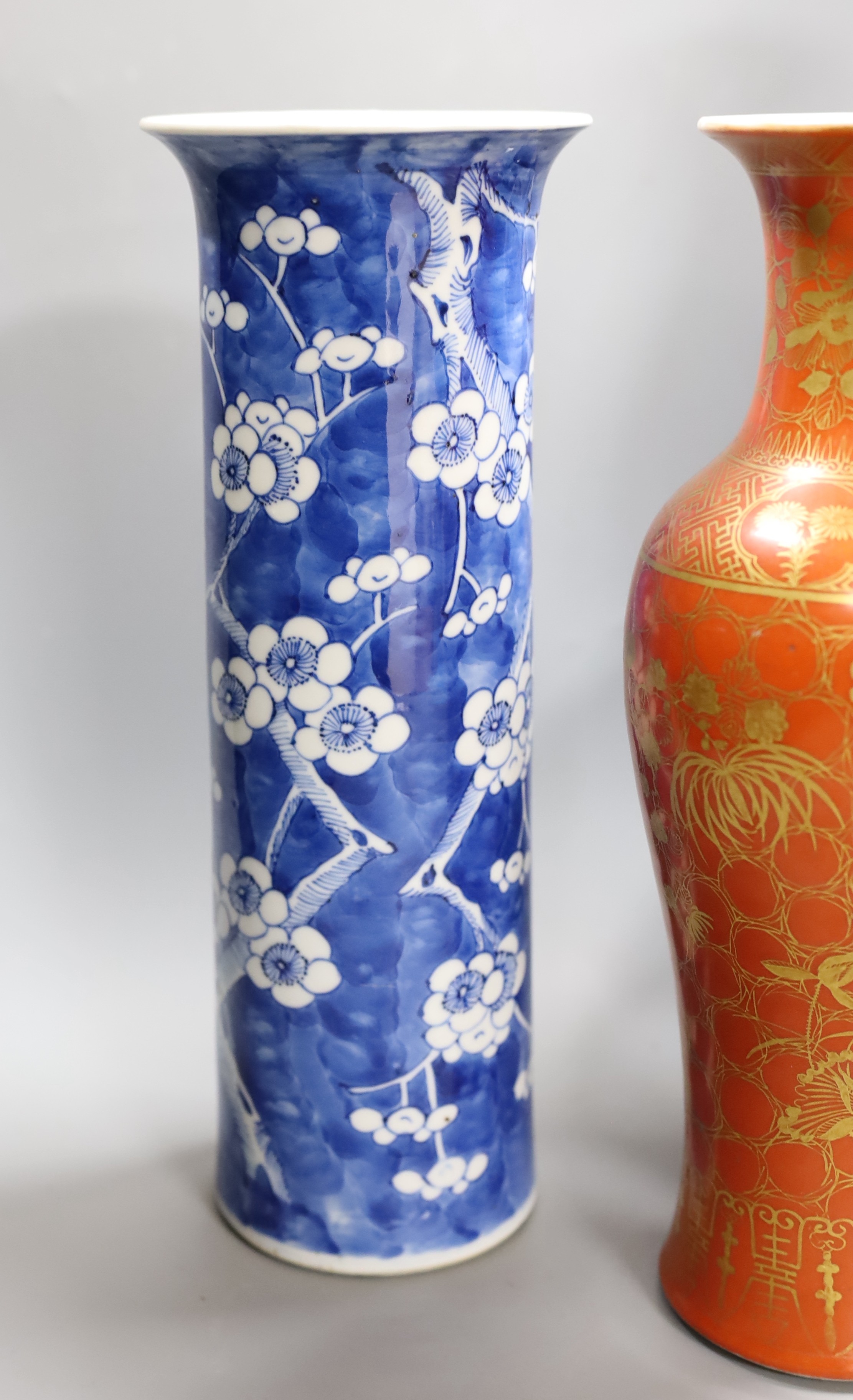 A Chinese blue and white gourd vase with landscape decoration, a similar blue and white sleeve vase and a Japanese Kutani vase